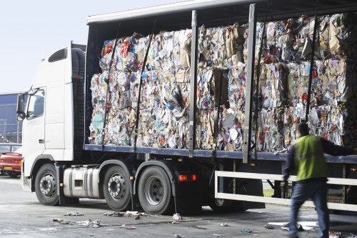 Professional rubbish removal team handling waste