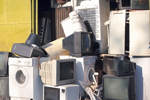 Professionals sorting items for house clearance